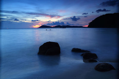 Scenic view of sea against sky at sunset