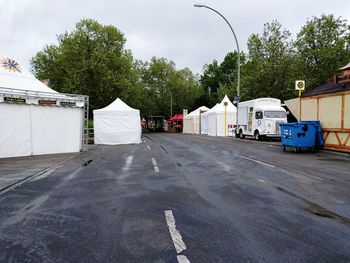 Tents on street against sky