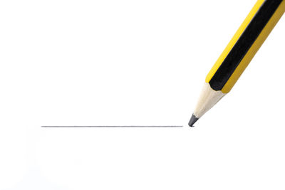 High angle view of pencils against white background