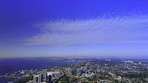 Aerial view of cityscape against sky at night