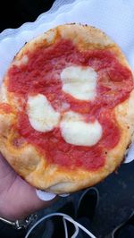 Close-up of hand holding ice cream