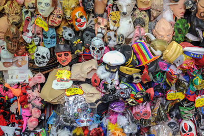 Multi colored toys and face masks for sale at market stall