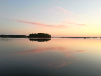 Reflection of clouds in calm lake