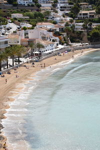 Scenic view of beach against buildings in city