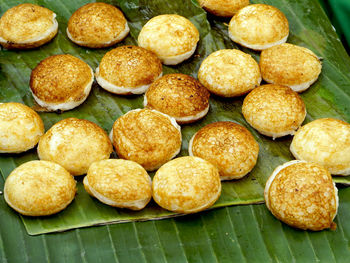 Sweet and savory grilled coconut-rice hotcakes,  asian dessert, thai, thailand, luang prabang, laos