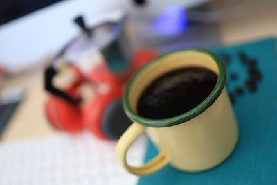 Close-up of coffee cup on table