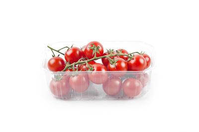 Close-up of tomatoes against white background