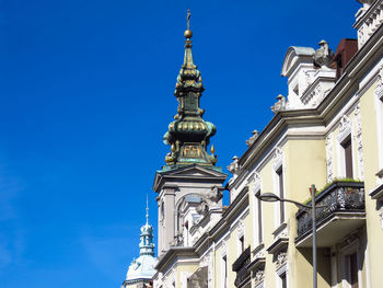 Low angle view of building against blue sky