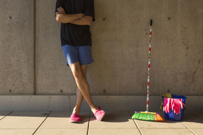 Low section of man standing on floor