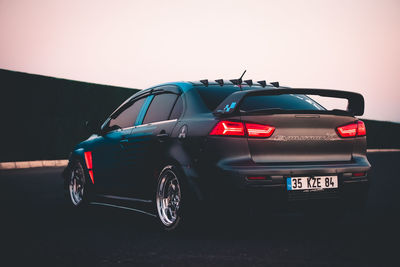 Toy car on road against sky