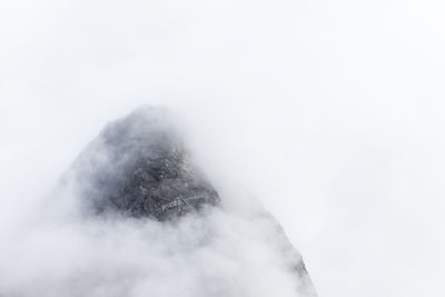 Low angle view of snow against sky