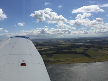 Cropped image of airplane over landscape