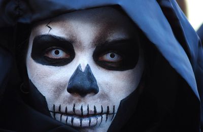 Close-up portrait of man in devil mask