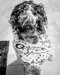 High angle view of girl wrapped in towel