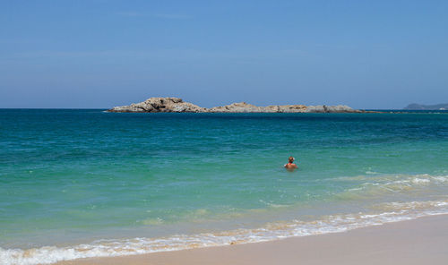 Scenic view of sea against blue sky