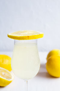 Close-up of yellow fruit against white background