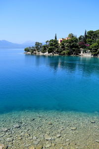 Scenic view of sea against clear blue sky