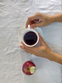 Hand holding coffee cup
