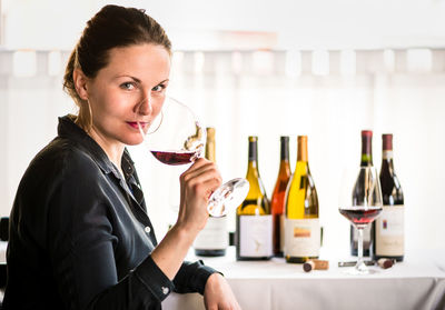 Portrait of woman holding drink