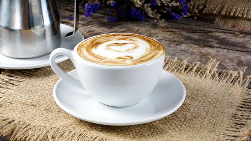 Close-up of cappuccino on table