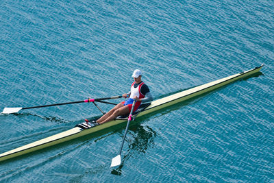 High angle view of athlete rowing on sea