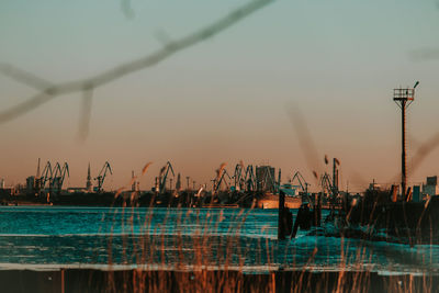 Pier at harbor against sky