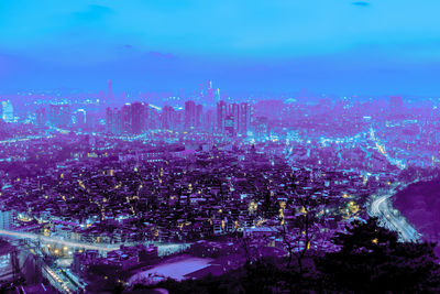 High angle view of illuminated cityscape at night