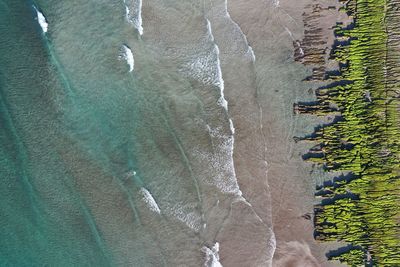 High angle view of rocks by sea