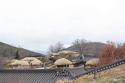 High angle view of roof and building against sky