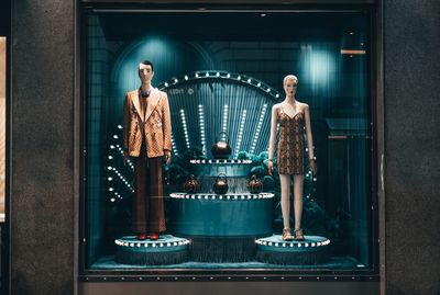 Young woman standing against the wall