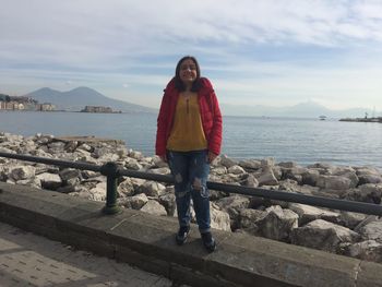 Full length of a woman standing in water