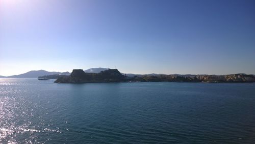 Scenic view of sea against clear blue sky