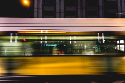 Blurred motion of tram in city at night