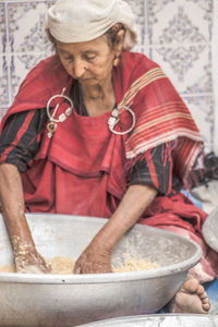 Midsection of woman cooking food