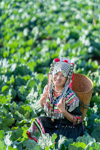 Woman wearing hat and plants