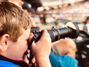 Portrait of boy photographing