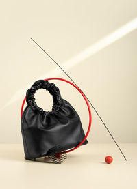 Black handbag. idea of suprematism. conceptual creative modern still life, balance composition