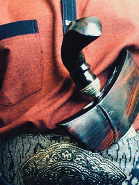 High angle view of man working on metal