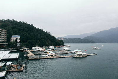 High angle view of boats in sea against sky