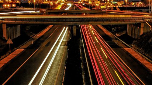 High angle view of light trails on road at night