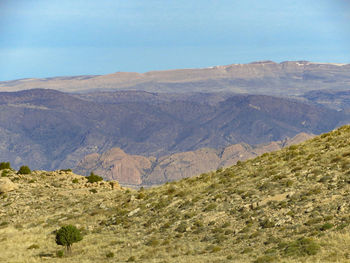 Scenic view of landscape and mountains against sky