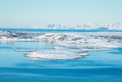 Scenic view of sea against clear blue sky