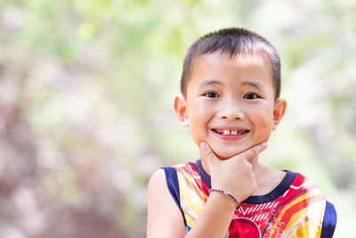 Close-up portrait of cute smiling boy