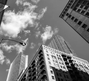 Low angle view of buildings in city against sky