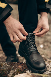 Midsection of man working with hands