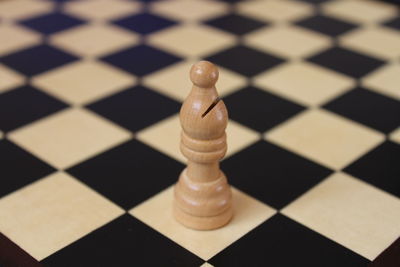 Close-up of chess piece on board