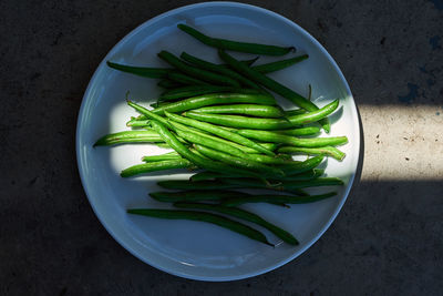 High angle view of green beans on table