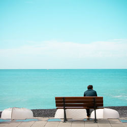 Rear view of man looking at sea