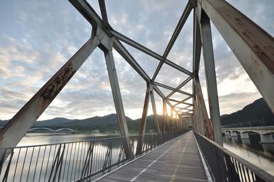 Bridge over road against sky