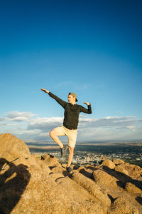 Full length of man standing on rock